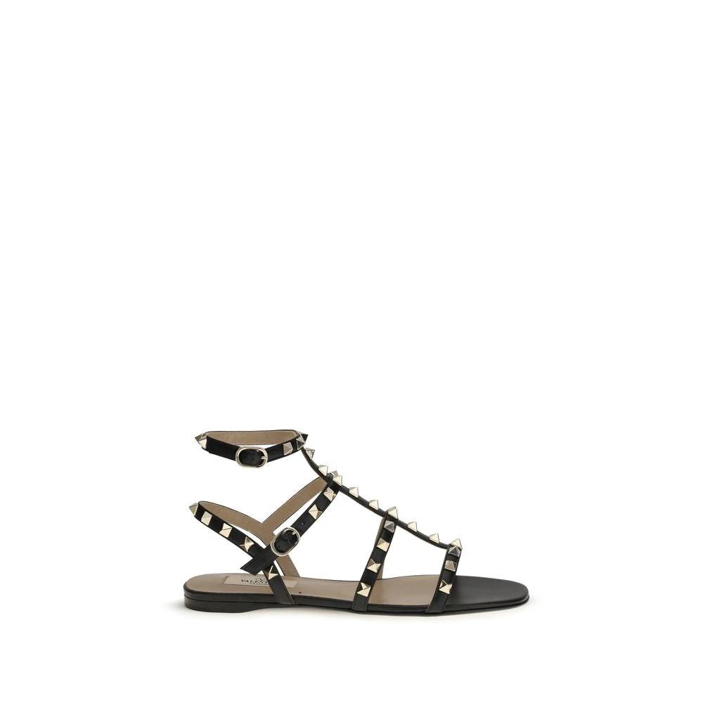 Valentino Garavani Schwarze Bos Taurus Kalbsleder Sandalen mit flacher Sohle by Valentino Garavani