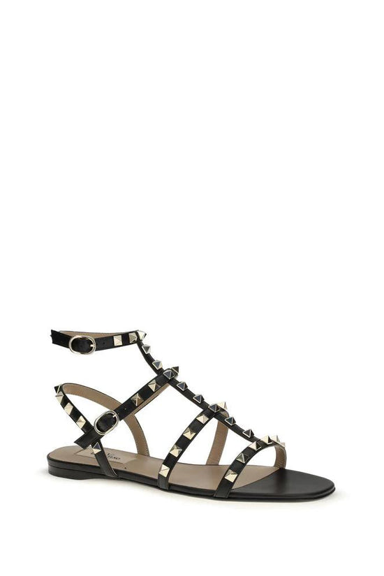 Valentino Garavani Schwarze Bos Taurus Kalbsleder Sandalen mit flacher Sohle by Valentino Garavani