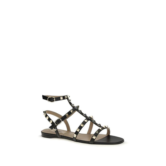 Valentino Garavani Schwarze Bos Taurus Kalbsleder Sandalen mit flacher Sohle by Valentino Garavani