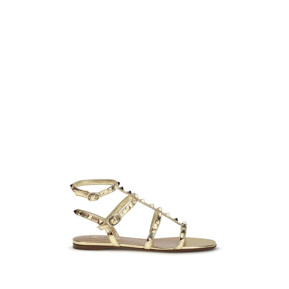 Valentino Garavani Flache Sandalen aus Kalbsleder Bos Taurus in Gold by Valentino Garavani