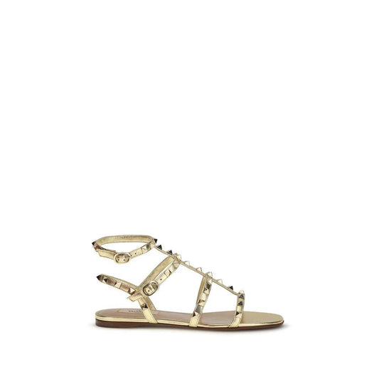 Valentino Garavani Flache Sandalen aus Kalbsleder Bos Taurus in Gold by Valentino Garavani
