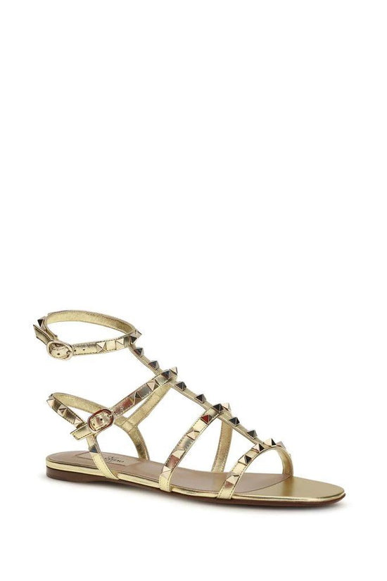 Valentino Garavani Flache Sandalen aus Kalbsleder Bos Taurus in Gold by Valentino Garavani