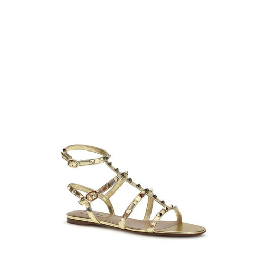 Valentino Garavani Flache Sandalen aus Kalbsleder Bos Taurus in Gold by Valentino Garavani