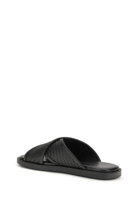 Ferragamo Schwarze Bos Taurus Kalbsleder flache Sandalen by Ferragamo